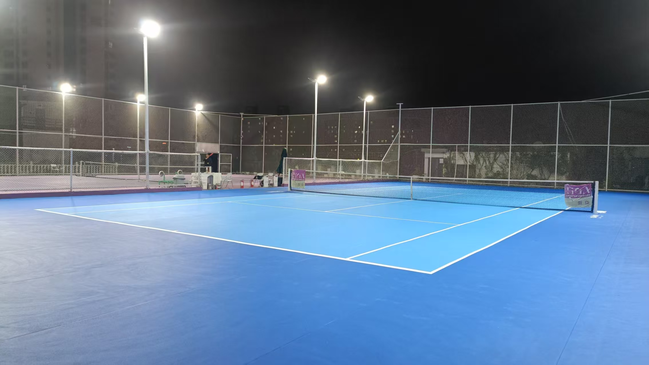 Outdoor panoramic pickleball court night view