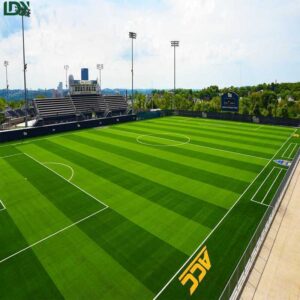 Football artificial turf installation process including base layer preparation and infill for stable playing surface