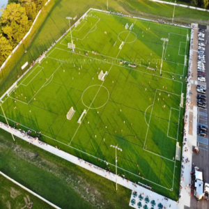 Synthetic football turf installed for outdoor soccer stadium and school sports field with excellent drainage performance