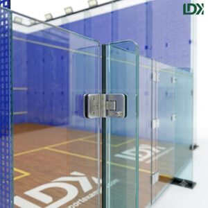 Close-up of LDK squash court tempered glass door and premium stainless steel hardware hinges, highlighting manufacturing engineering and quality details.