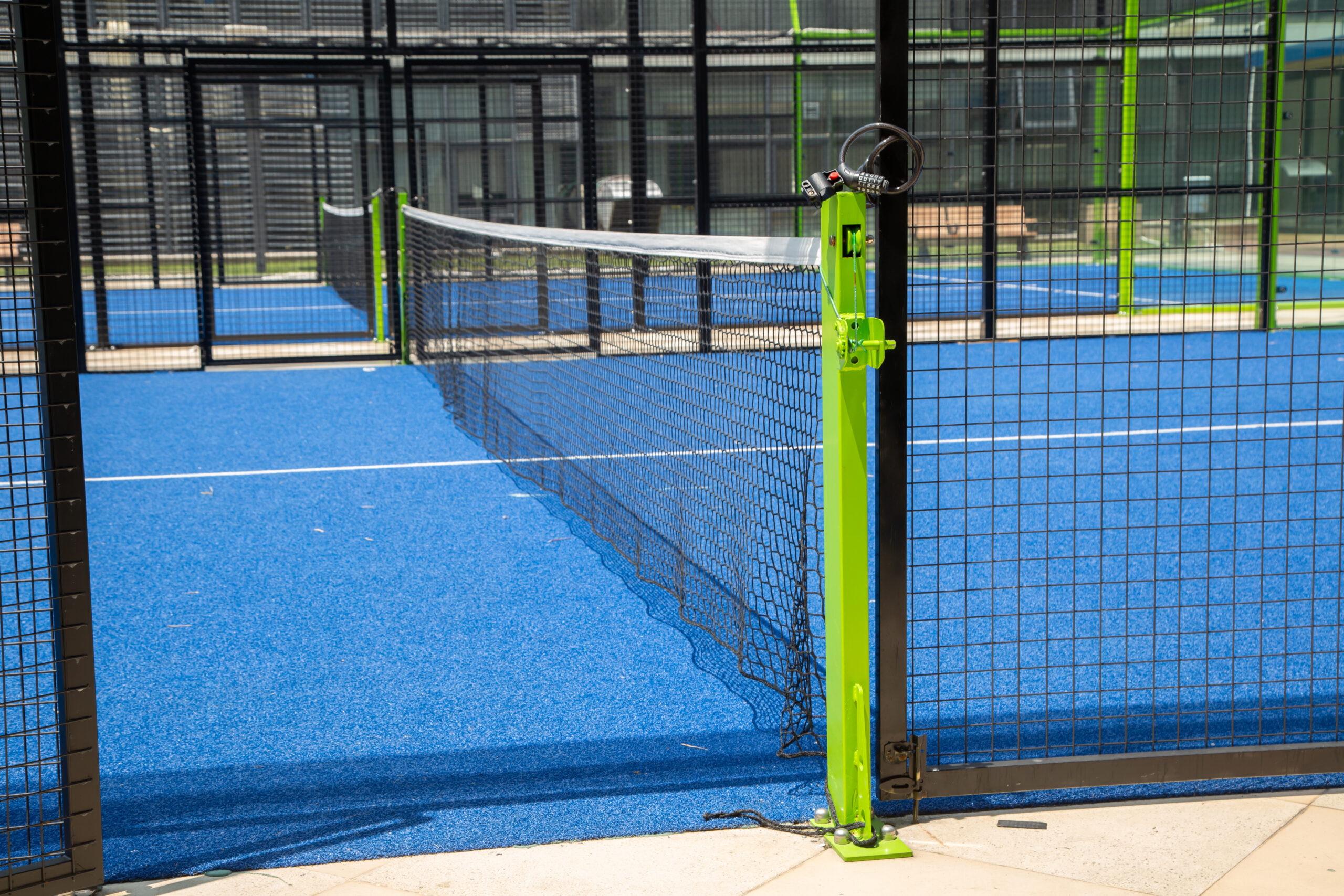 close up of professional padel court net showing mesh detail and tension system
