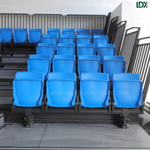 Closeup of LDK electric grandstand seats, high-quality blue plastic seats with stable mounting structure for stadiums