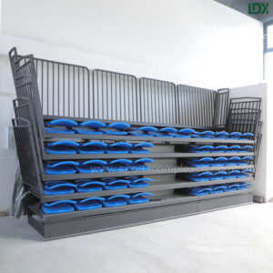 Side detail of LDK retractable bleachers, foldable seat design with anti-slip steps for indoor sports halls