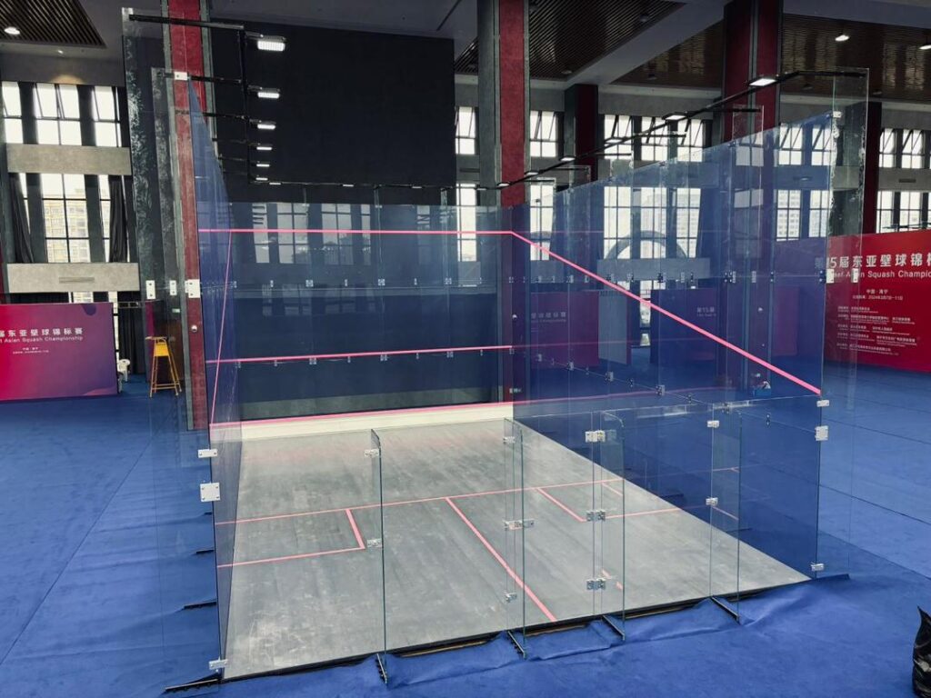 complete indoor glass squash court setup Full view of a professionally installed indoor glass squash court ready for competition.