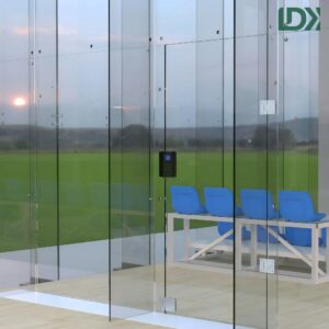 Access control system mounted on outdoor glass squash court entrance