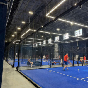 LDK indoor padel court project in Russia with 12 mm tempered glass walls and blue artificial turf