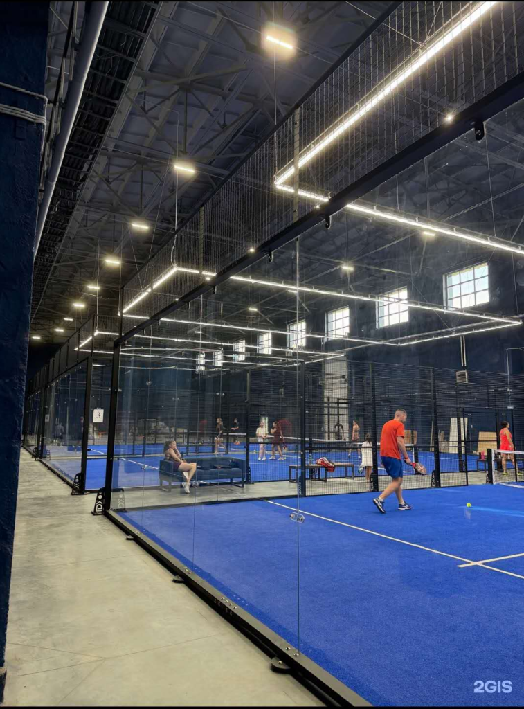 LDK indoor padel court project in Russia with 12 mm tempered glass walls and blue artificial turf